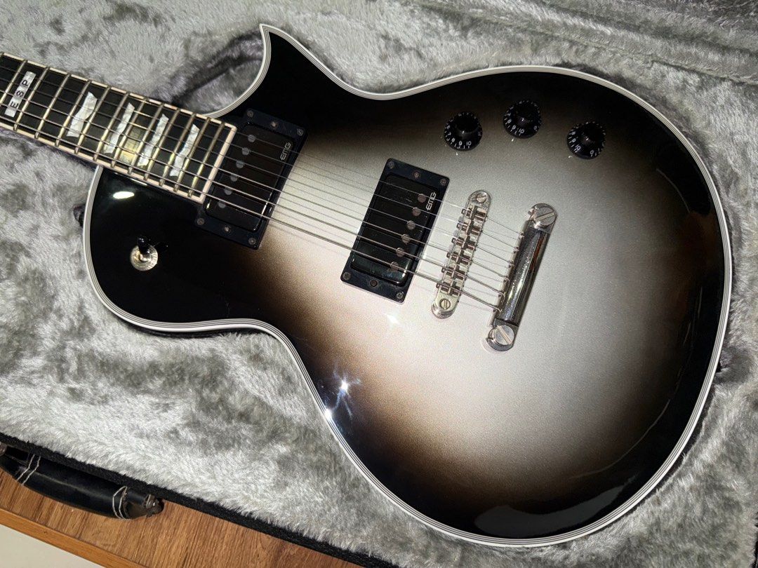 ESP Eclipse Silverburst (Category: Musical Instruments) located in Singapore. Submitted by batzz3177 (Listing ID 1365115818, Image 4). Description: Selling a 2010 ESP Standard series Eclipse in Silverburst. Very Les Paul custom vibes. Guitar is set up with 10-46 strings. Guitar has normal wear from use but the frets are as good as new. Guitar in overall good condition except a chip on the back of the headstock as shown in the last pic which the p