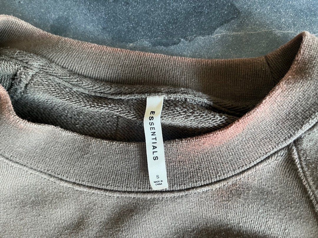 Fear of God Essentials Sweater (Category: Coats, Jackets and Outerwear) located in Manila. Submitted by cappinjay (Listing ID 1364965800, Image 3). Description: Fear of God Essentials Sweater Condition: Well Used, Decoloration on collar Color: Olive/Green Side Zippers style Size Small, Can fit XS 100% Authentic .