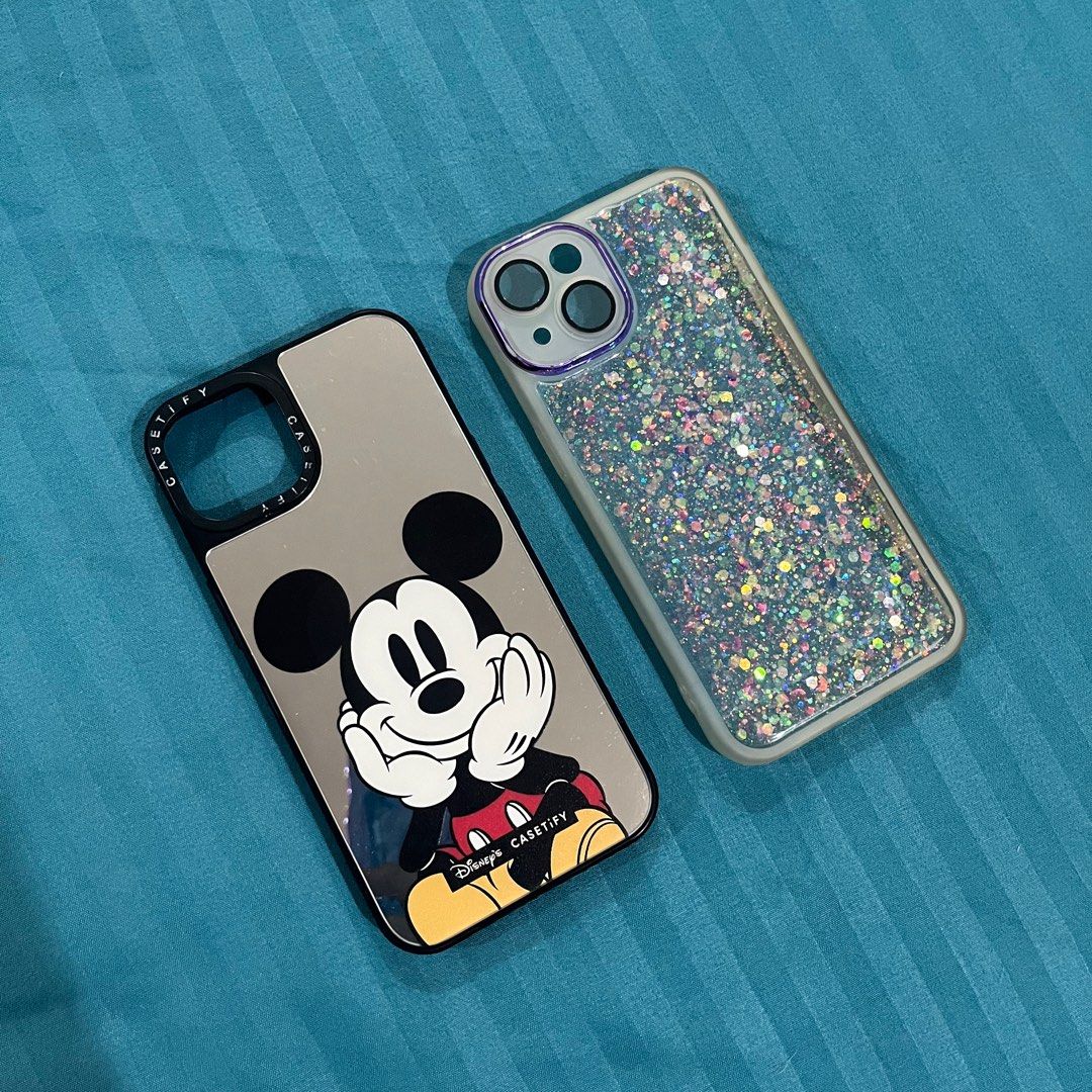 Iphone 13 Cases - Casetify Disney Mickey Mouse, Transparent Glitter (Category: Cases & Sleeves) located in Pasig City. Submitted by beabimbop (Listing ID 1365046210, Image 1). Description: 🌷 Take both for Php 200 only! 🌷 If buy indiv.: • Casetify Disney Mickey Mouse case (mirror) - Php 150 • [SOLD ❌] Glitter case (transparent) 🌷 In good condition RFS: Decluttering.