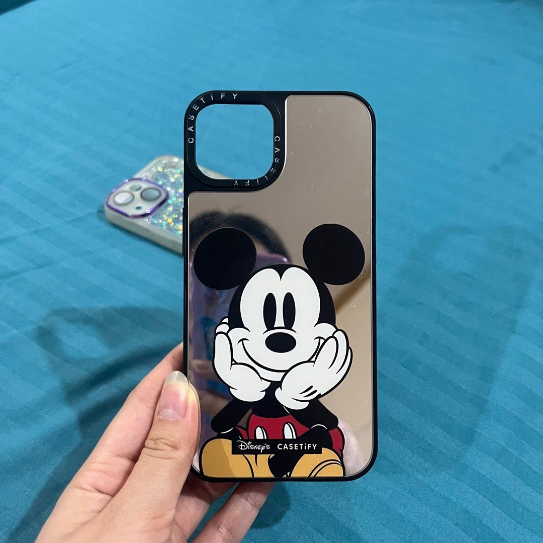 Iphone 13 Cases - Casetify Disney Mickey Mouse, Transparent Glitter (Category: Cases & Sleeves) located in Pasig City. Submitted by beabimbop (Listing ID 1365046210, Image 2). Description: 🌷 Take both for Php 200 only! 🌷 If buy indiv.: • Casetify Disney Mickey Mouse case (mirror) - Php 150 • [SOLD ❌] Glitter case (transparent) 🌷 In good condition RFS: Decluttering.