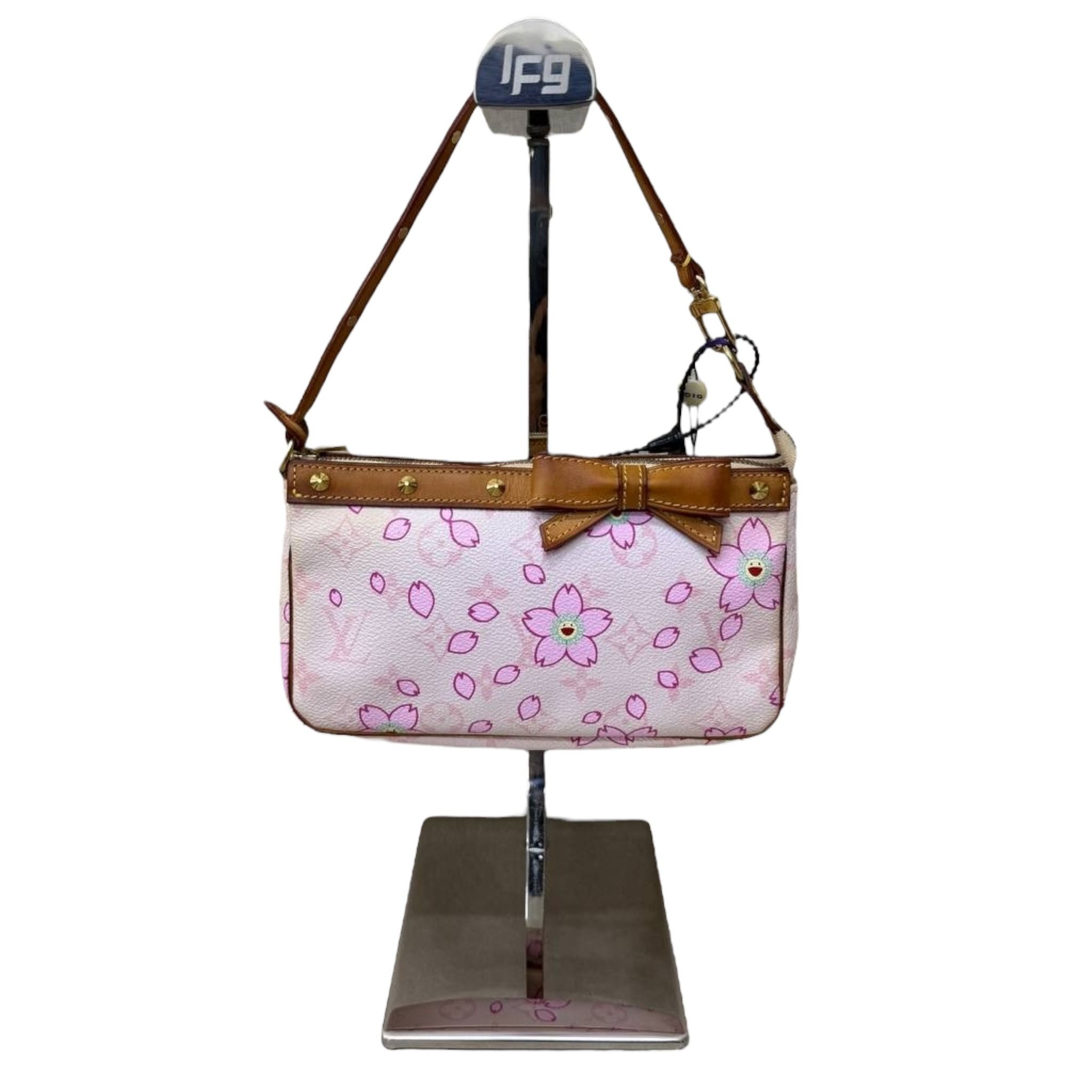 Louis Vuitton X Takashi Murakami Pochette in Pink Cherry Blossom (Category: Bags & Wallets) located in Singapore. Submitted by projectlfg (Listing ID 1365046650, Image 1). Description: Louis Vuitton X Takashi Murakami Pochette in Pink Cherry Blossom Condition 98% New. Year: AR0023 Accessories: - Size: 21x3.5x12 / SGD: 1800 • ACRA Registered Company in Singapore • Physical Outlets in Singapore and China • Entrupy Verified Business • Authenticity G