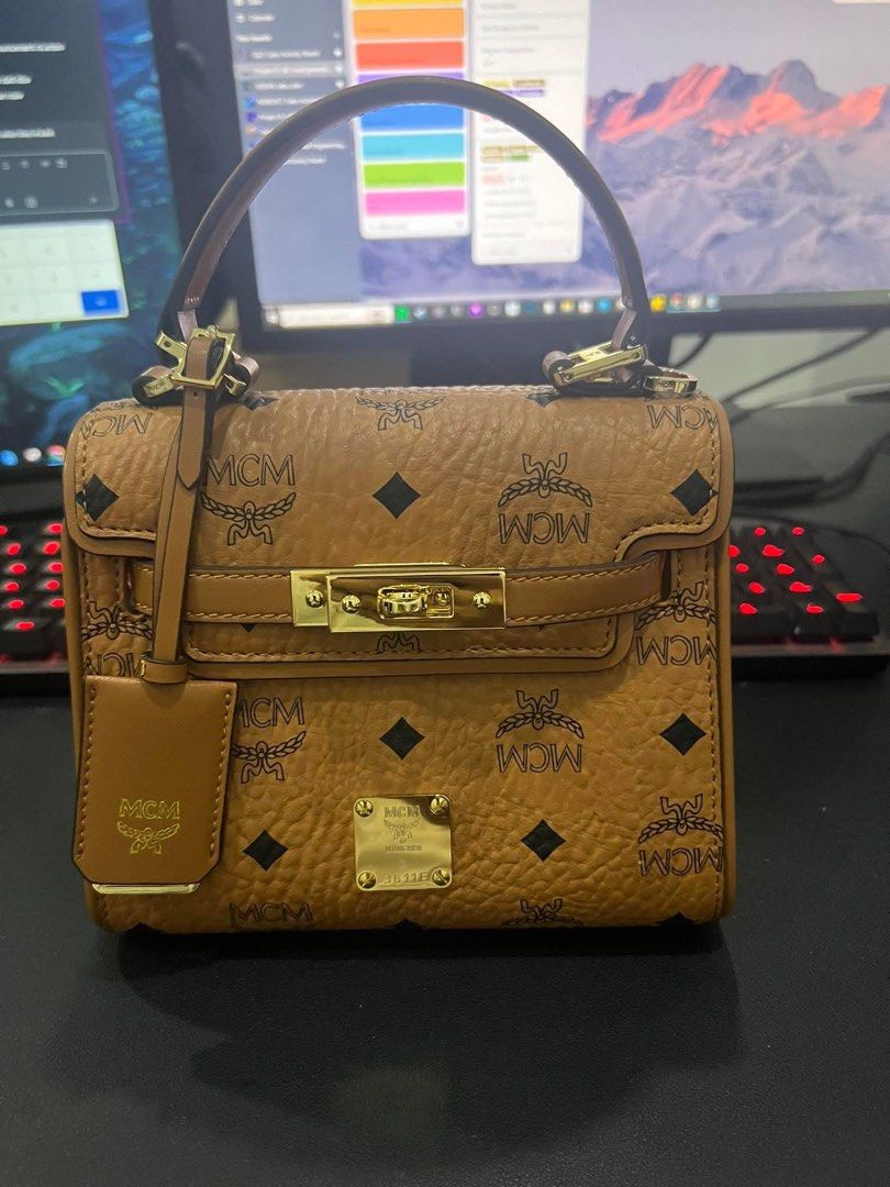 MCM heritage mini satchel in visetos (Category: Luxury Bags & Wallets) located in Cebu City. Submitted by rjcdadi (Listing ID 1365115926, Image 1). Description: Selling my personal pre loved mcm satchel. Purchased from MCM Korea. Complete with sling strap, dust-bag, lock and key. Condition: 7/10 minimal signs of use. Comes with authenticity certificate for your peace of mind. RFS: no longer using it as much..decluttering You may send me a message
