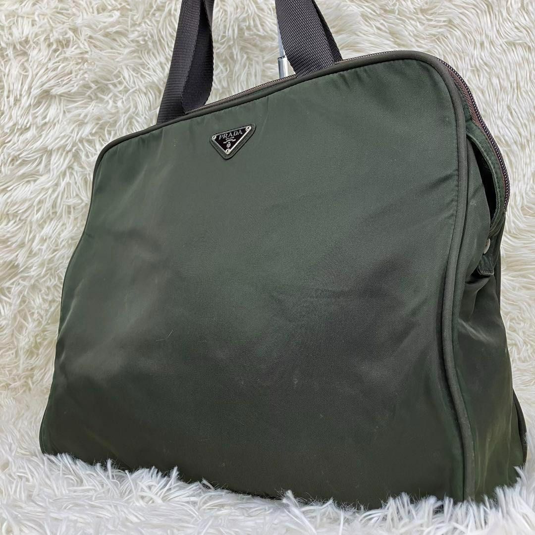Prada Tessuto Nylon Briefcase / Handbag (Category: Luxury Bags & Wallets) located in Manila. Submitted by bottegalover (Listing ID 1365059391, Image 2). Description: Prada Tessuto Nylon Briefcase/Handbag Width (W): 35.5cm Height (H): 30cm Depth (D): 9.5cm Inclusions: Bag only Last pic taken from another vintage online store for price reference Shipping: Via Lalamove, Grab Mode of Payment: Bank Transfer or GCash only Tags: prada celine dior armani