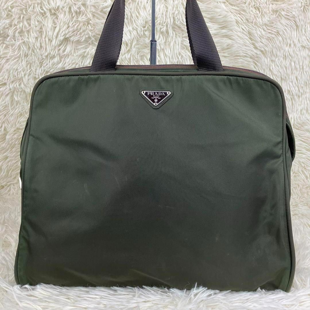 Prada Tessuto Nylon Briefcase / Handbag (Category: Luxury Bags & Wallets) located in Manila. Submitted by bottegalover (Listing ID 1365059391, Image 1). Description: Prada Tessuto Nylon Briefcase/Handbag Width (W): 35.5cm Height (H): 30cm Depth (D): 9.5cm Inclusions: Bag only Last pic taken from another vintage online store for price reference Shipping: Via Lalamove, Grab Mode of Payment: Bank Transfer or GCash only Tags: prada celine dior armani