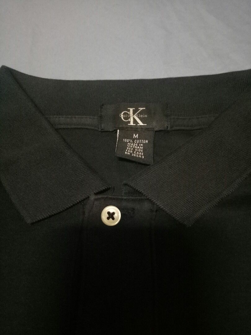 calvin klein black shirt (Category: Tshirts & Polo Shirts ) located in Manila. Submitted by freespace01 (Listing ID 1365209441, Image 1). Description: calvin klein black polo shirt color rate 7/10 shoulder - 18 inches length - 28 inches.
