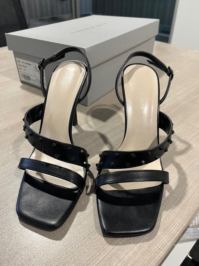 Charles & keith asymmetric studded sandals (Category: Heels) located in Las Pinas. Submitted by masterjac (Listing ID 1365231649, Image 2). Description: Decluttering. Used twice at most. MOP: Metrobank / gcash Buyer to book own courier. Location is near Festival mall Alabang. Monday-Thursdays 7:00 AM to 3:00 PM. Thank you .