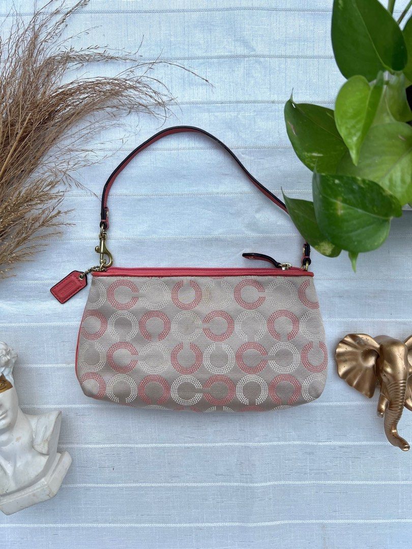 Coach Signature Red/Brown Pochette/Wristlet (Category: Luxury Bags & Wallets) located in Floridablanca. Submitted by lj_domasian (Listing ID 1365150621, Image 2). Description: Original! Coach Signature Red/Brown Pochette/Wristlet ₱3,300 𝗜𝗻𝗰𝗹𝘂𝘀𝗶𝗼𝗻/𝘀: c0.ach charm 𝑪𝒐𝒏𝒅𝒊𝒕𝒊𝒐𝒏: 8.5/10 - good condition ~ 𝐂𝐨𝐧𝐝𝐢𝐭𝐢𝐨𝐧 𝐝𝐞𝐬𝐜𝐫𝐢𝐩𝐭𝐢𝐨𝐧👇🏼 - no flaws. Minor signs of use only. 𝗗𝗶𝗺𝗲𝗻𝘀𝗶𝗼𝗻𝘀: 👇🏼 Length - 9.5” Height 