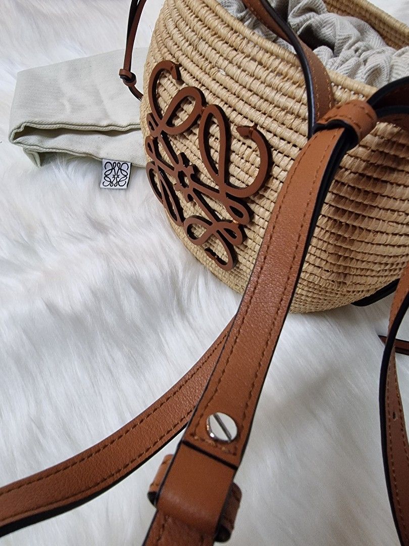 Loewe Beehive Basket Bucket Shoulder Bag (Category: Luxury Bags & Wallets) located in Manila. Submitted by facet.ornament (Listing ID 1365273525, Image 3). Description: Loewe 'Beehive Basket' bucket shoulder bag Authentic 💯 Japan bought 🇯🇵 Description: Beige 'Beehive Basket' bucket shoulder bag from Loewe. Made from raffia and trimmed with leather, this design cinches closed with drawstrings and features a brown monogram pattern, adjustable st