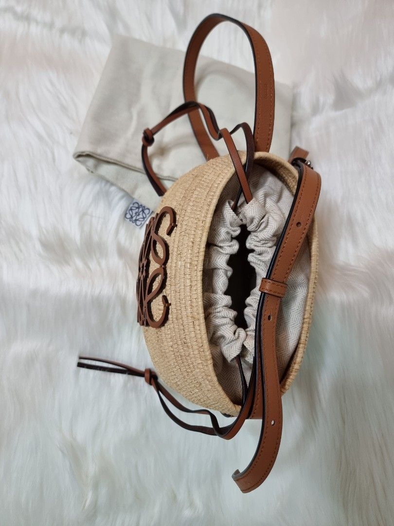 Loewe Beehive Basket Bucket Shoulder Bag (Category: Luxury Bags & Wallets) located in Manila. Submitted by facet.ornament (Listing ID 1365273525, Image 2). Description: Loewe 'Beehive Basket' bucket shoulder bag Authentic 💯 Japan bought 🇯🇵 Description: Beige 'Beehive Basket' bucket shoulder bag from Loewe. Made from raffia and trimmed with leather, this design cinches closed with drawstrings and features a brown monogram pattern, adjustable st