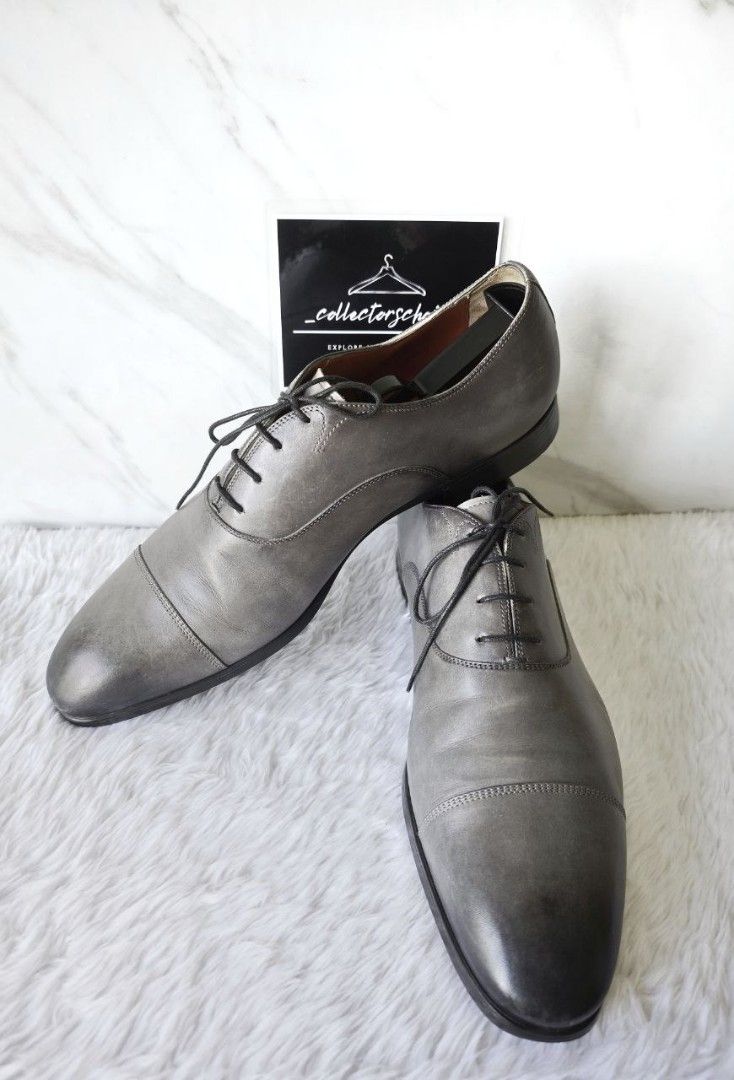 Santoni Charcoal Men's Laced Shoes (Category: Dress Shoes) located in Makati City. Submitted by _collectorschoice_ (Listing ID 1365290653, Image 3). Description: ° Elegant and distinctive, this Oxford lace-up is an emblem of Santoni’s artisanal expertise, bringing refined sophistication to formal looks and extra-special occasions. ° Its fine leather construction is treated with the charming allure of our iconic “velatura” gradated finish. A Goody