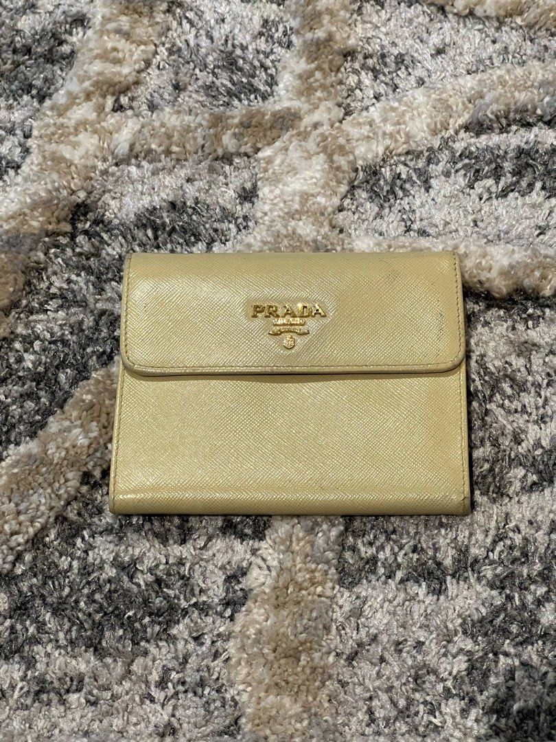 For Sale Original Prada Wallet (Category: Luxury Bags & Wallets) located in Caloocan City. Submitted by dandannnn2525 (Listing ID 1365416872, Image 3). Description: Prada Saffiano Compact Wallet Color: Beige Condition: as per inspection, mukhang nag undergone ng color retouch, over all useable pa naman ang leather, may mga minimal stains lang as seen in the photo. .