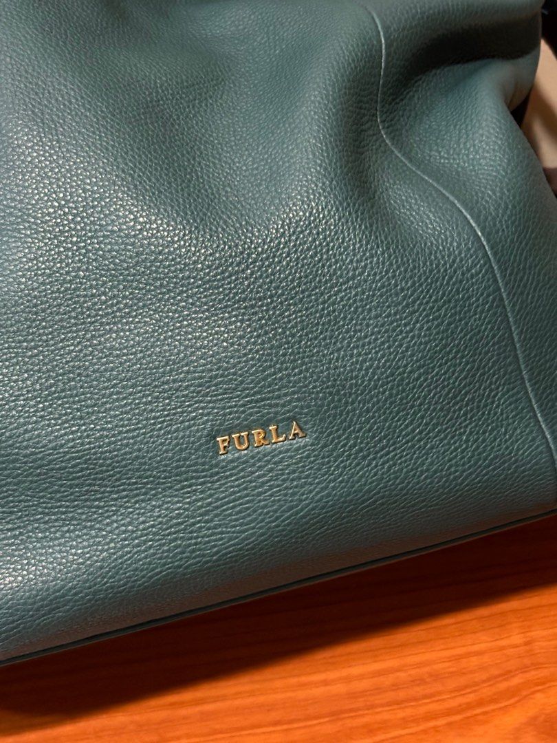 Furla 2-way Bag in Green Leather (Category: Luxury Bags & Wallets) located in Davao. Submitted by cherrysusie (Listing ID 1365449015, Image 2). Description: Furla 2-way Bag in Green Leather 🔴Rank A DM for more inquiries📩 ‼️All bags and shoes posted are authentic. Disclaimer: We are not affiliated with the brands we sell. All trademarks and/or copyrights belong to the respective owners..