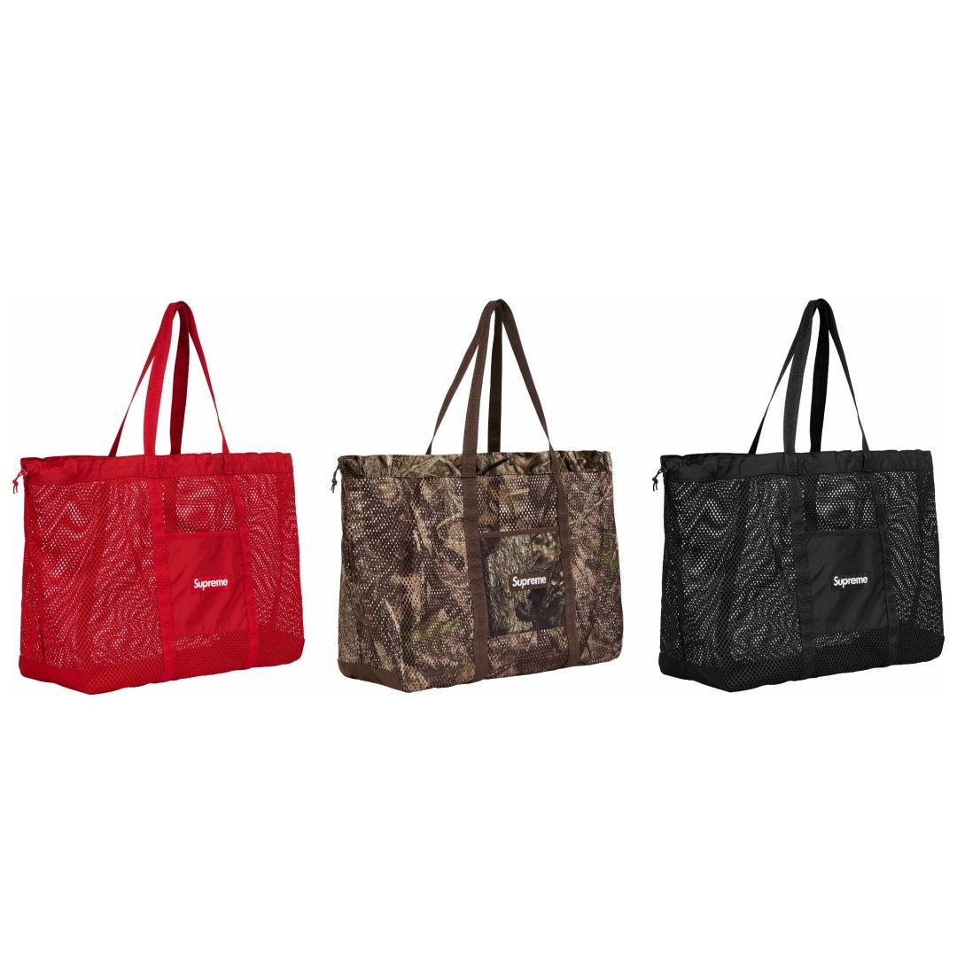 SS25 Supreme Mesh Tote Bag (Category: Tote Bags) located in Singapore. Submitted by sneakersclinic (Listing ID 1365442287, Image 1). Description: Supreme Mesh Tote Bag "Red" - (SGD$249) Availability: Available Supreme Mesh Tote Bag "TrueTimber Kanati Camo" - (SGD$249) Availability: Available Supreme Mesh Tote Bag "Black" - (SGD$249) Availability: Available [Product Description] Season: Spring/Summer 2025 (SS25) - Poly eyelet mesh with Cordura® ba