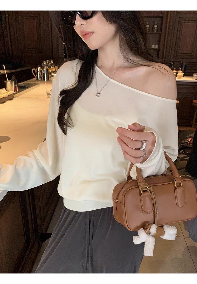 Wide Shoulder Long Sleeves Tencel Top (Category: Longsleeves) located in Singapore. Submitted by mommystote (Listing ID 1365321460, Image 3). Description: ✨Wide Shoulder Long Sleeves Tencel Top✨ Preorder • arrives in about two weeks Sizing ➕length ➕shoulder ➕chest M:61,64,116 L:63,65,120 This T-shirt can be worn normally or off the shoulder. Made from Tencel fabric, it’s soft and drapes smoothly. It feels light and burden-free on the body, offeri