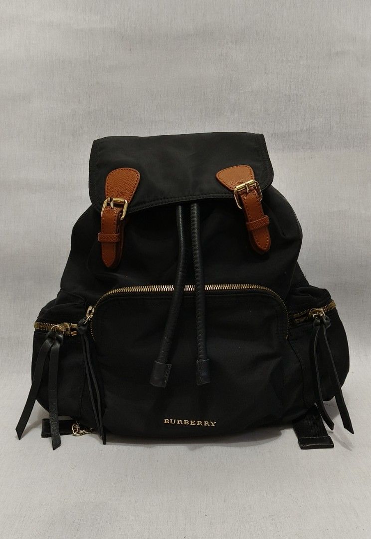 Burberry Black Nylon Rucksack Backpack (Category: Luxury Bags & Wallets) located in Baguio. Submitted by PreiLoveMaria (Listing ID 1365630851, Image 3). Description: Burberry Black Nylon Rucksack Backpack Good used condition With manageable flaws/signs of used Kindly refer to the last photo Medium Capacity Kindly check the Detailed photos Shipping via J&T only No COD and COP Item is from Japan Surplus.