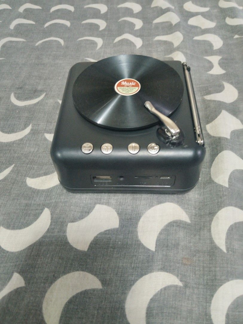 mini speaker turntable (Category: Portable Music Players) located in Manila. Submitted by boyhet.thrift15 (Listing ID 1365528868, Image 1). Description: mini speaker bluetooth/TF card/AUX/no usb cord kasama bili na,lang kayo micro usb slight used item nd gud condition naman.selling 350.