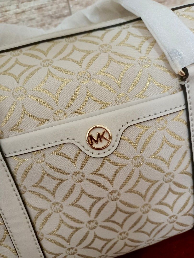 MK Medium Duffle Satchel Bag in White-Gold (Category: Luxury Bags & Wallets) located in Dasmarinas. Submitted by lovedbyleslee (Listing ID 1365480497, Image 3). Description: 💯ORIGINAL from US, moneyback guaranteed with tag (retails for 678$) with long leather strap.