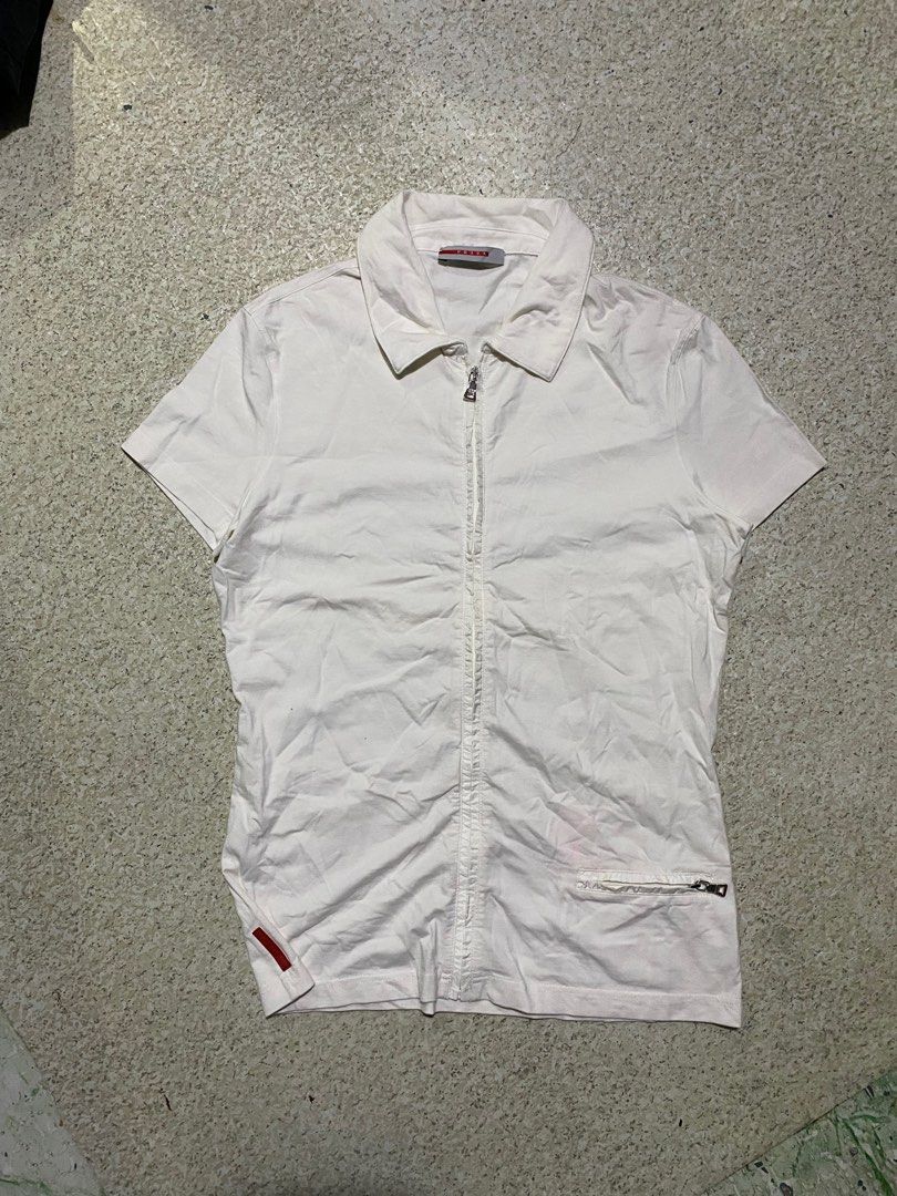 Prada fullzip Blouse (Category: Luxury Apparel) located in Valenzuela. Submitted by rektasource.ph (Listing ID 1365621145, Image 1). Description: Vintage Prada fullzip Blouse Cut Washtag Need wash Length: 23 Width: 16.5.