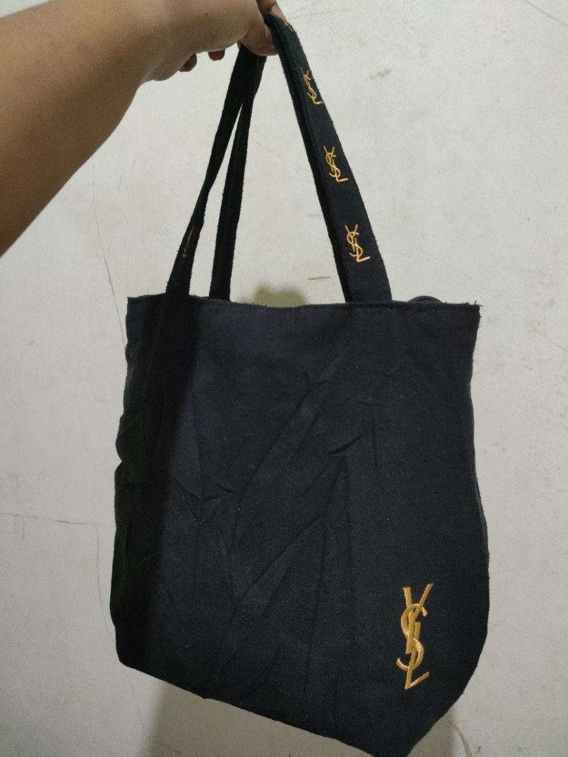 YSL tote bag (Category: Luxury Bags & Wallets) located in Sindangan. Submitted by branden_line (Listing ID 1365571433, Image 1). Description: canvas ysl tote bag color:gold/black embroidered logo with zipper closure safe to wear in very good condition.