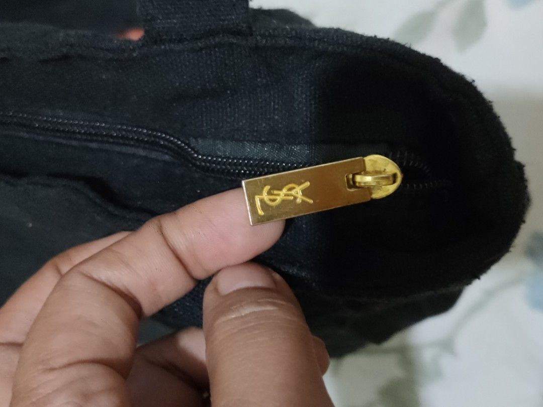 YSL tote bag (Category: Luxury Bags & Wallets) located in Sindangan. Submitted by branden_line (Listing ID 1365571433, Image 3). Description: canvas ysl tote bag color:gold/black embroidered logo with zipper closure safe to wear in very good condition.