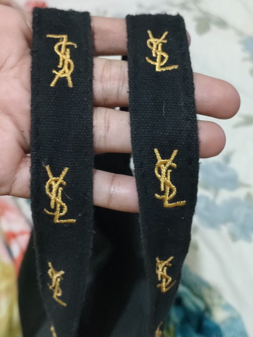 YSL tote bag (Category: Luxury Bags & Wallets) located in Sindangan. Submitted by branden_line (Listing ID 1365571433, Image 2). Description: canvas ysl tote bag color:gold/black embroidered logo with zipper closure safe to wear in very good condition.