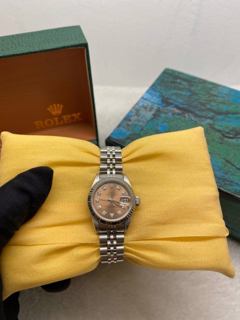 Authentic Rolex 26mm Rolex Datejust!! (Category: Luxury Watches) located in Quezon City. Submitted by jhaediah (Listing ID 1365659714, Image 3). Description: FASTBREAK SALEEEE! 26mm Rolex Datejust!! • Reference 69174 • Year 1995 W Series • White Gold Fluted Bezel • Rare Salmon Pink Big Diamond Dial • 9.8/10 Condition / Mint Condition • Inclusions: Watch, Presentation Box, Proof of Purchase/Verification Paper from Gentry Timepieces 💯 (Warranty un