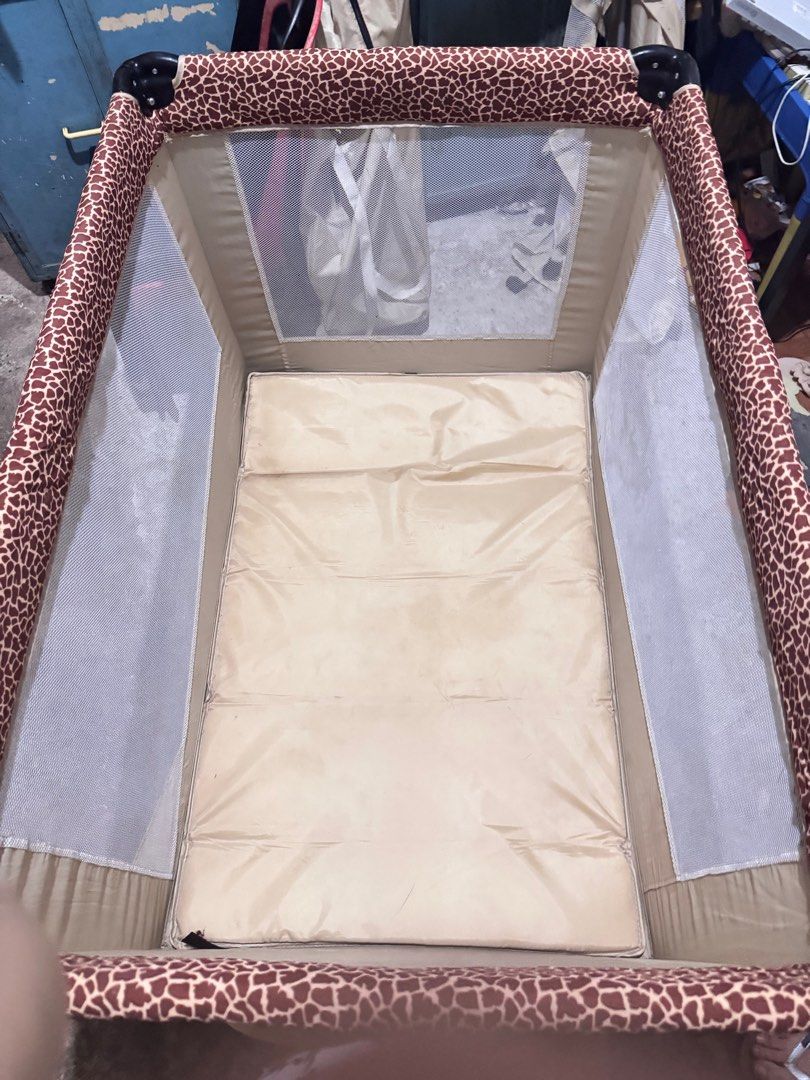 Baby 1st Crib Preloved (Category: Cots & Cribs) located in Taguig. Submitted by findsbyjea (Listing ID 1365816227, Image 2). Description: Baby 1st Leopard Print Crib – Preloved! • Brand: Baby 1st • Design: Stylish Leopard Print • Size: 42” x 31” x 31” (mas maluwag kaysa regular playpen) • Condition: Barely used, kasi baby preferred co-sleeping • Parts: Complete frame and mattress • Missing: Changing mat at bottle organizer lang • Issue: Minor dir