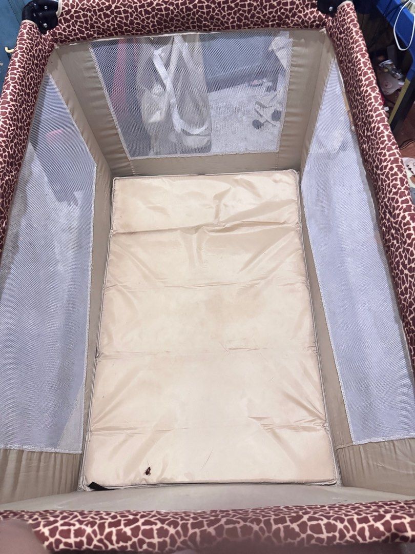 Baby 1st Crib Preloved (Category: Cots & Cribs) located in Taguig. Submitted by findsbyjea (Listing ID 1365816227, Image 3). Description: Baby 1st Leopard Print Crib – Preloved! • Brand: Baby 1st • Design: Stylish Leopard Print • Size: 42” x 31” x 31” (mas maluwag kaysa regular playpen) • Condition: Barely used, kasi baby preferred co-sleeping • Parts: Complete frame and mattress • Missing: Changing mat at bottle organizer lang • Issue: Minor dir