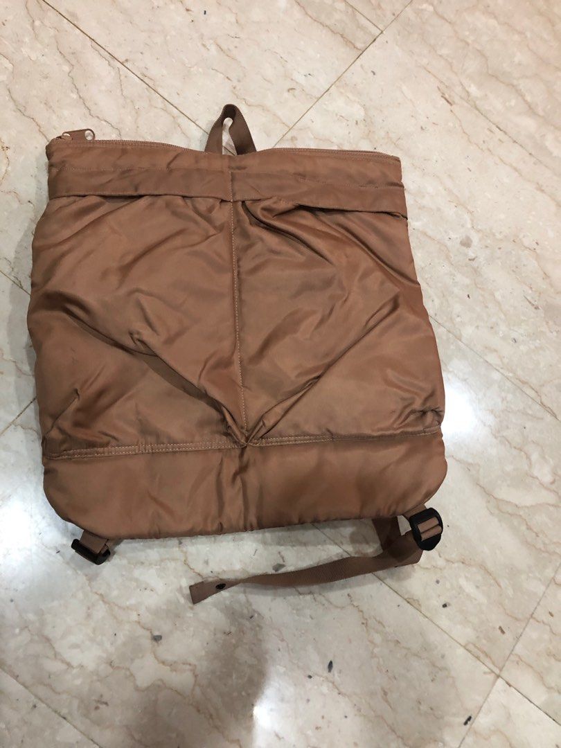 Brown Backpack (Category: Backpacks) located in Singapore. Submitted by ibiz8 (Listing ID 1365744926, Image 2). Description: Lightly used brown backpack. It has a few minor scuffs and marks, but overall in good condition. It's a great size for everyday use and has a spacious main compartment. The straps are adjustable and comfortable to wear. It's a great option for students, commuters, or anyone who needs a reliable backpack..