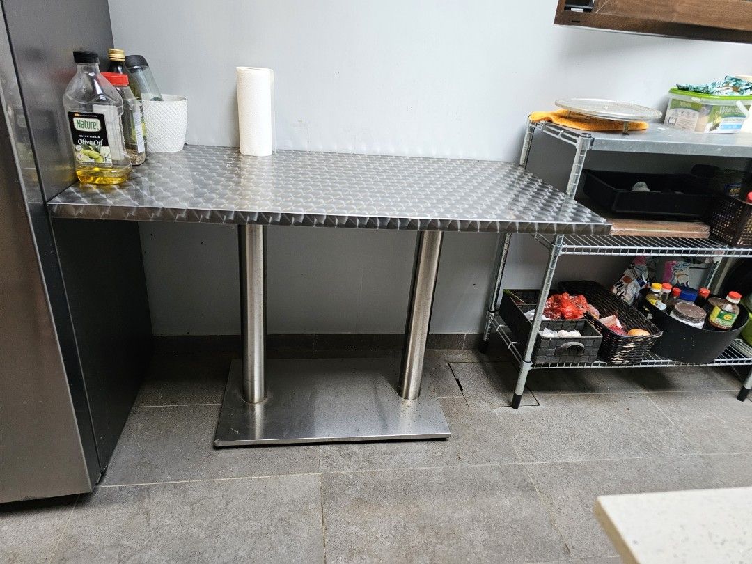 Dining Table (Category: Other Home Furniture) located in Singapore. Submitted by tansam2011.1 (Listing ID 1365749037, Image 2). Description: A year old stainless steel table. Letting go due to space constraints..