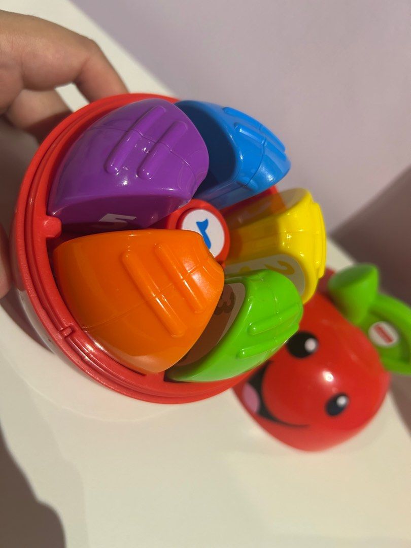 Happy Apple - Learning Toy (Category: Infant Playtime) located in Makati City. Submitted by spencer09 (Listing ID 1365665806, Image 2). Description: Laugh & Learn Learning Happy Apple This sweet twist on a play time classic combines learning and fun in one adorable toy •Age: 6 - 36M •5 numbered apple “slices” feature numbers and pictures to encourage learning. •Roly-poly base is perfect for bat-at fun •Press the apple “core” button to activate si