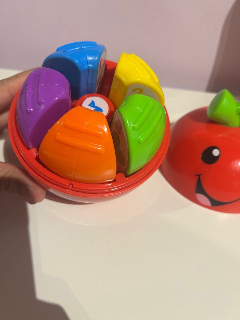 Happy Apple - Learning Toy (Category: Infant Playtime) located in Makati City. Submitted by spencer09 (Listing ID 1365665806, Image 3). Description: Laugh & Learn Learning Happy Apple This sweet twist on a play time classic combines learning and fun in one adorable toy •Age: 6 - 36M •5 numbered apple “slices” feature numbers and pictures to encourage learning. •Roly-poly base is perfect for bat-at fun •Press the apple “core” button to activate si