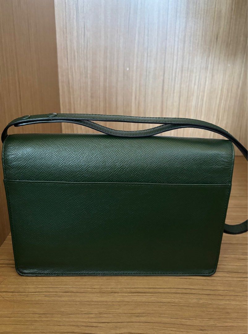LV Taiga leather (Category: Luxury Bags & Wallets) located in Manila. Submitted by treasure.trove.mnl (Listing ID 1365719952, Image 2). Description: Brand: Louis Vuitton Model: Louis Vuitton Taiga Clutch Bag converted into a shoulder and sling bag Color: Green, Gold hardware Material: leather Bag is vintage but in good condition. Cleaned, conditioned and added a strap by a trusted luxury leather repair shop. .