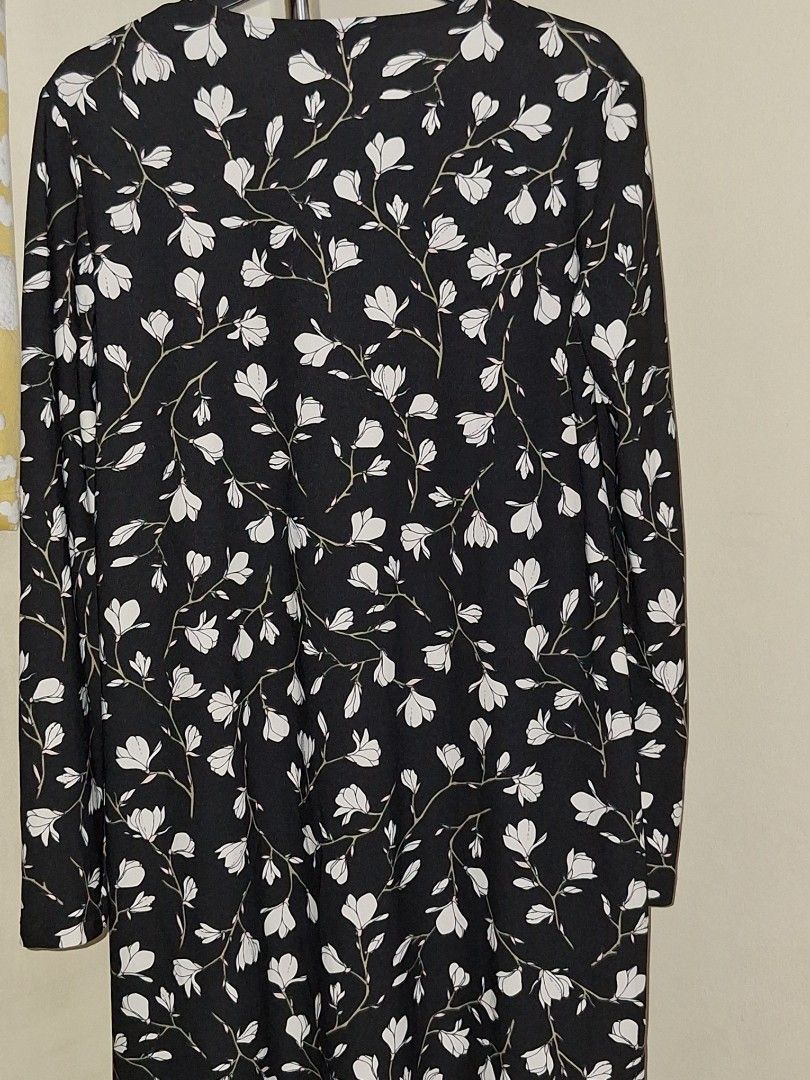 MANGO midi floral dress (Category: Dresses) located in Makati City. Submitted by worn2work_treasures (Listing ID 1365695599, Image 1). Description: Elegant and modest black A-line dress with a delicate floral pattern and long sleeves—perfect for semi-formal occasions. I'm 5'4", and the length falls about 1 inch above the knee, offering a classy and comfortable fit. I usually wear this to church, but it's also great for brunches, family gatherings