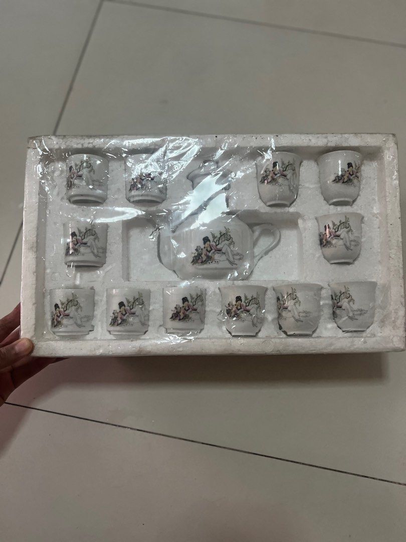 Teapot set (Category: Coffee & Tea Tableware) located in Pasig City. Submitted by notyouraveragestuff (Listing ID 1365690354, Image 3). Description: Brand new and sealed Tea set 12 tea cups and teapot No issue Rfs: decluttering.