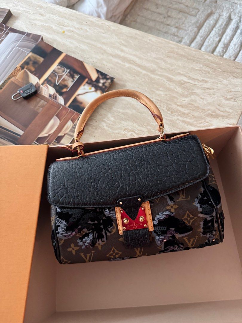 Authentic Louis Vuitton Fleur de jais Carrousel limited edition (Category: Luxury Bags & Wallets) located in Manila. Submitted by houseoflouvre (Listing ID 1365847426, Image 3). Description: Authentic Louis Vuitton limited edition Fleur de jais Carrousel Slightly used Comes complete with box, Dustbag, keys and lock, clochette.. .