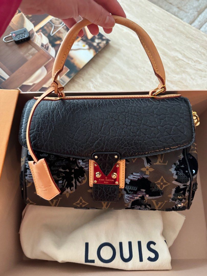 Authentic Louis Vuitton Fleur de jais Carrousel limited edition (Category: Luxury Bags & Wallets) located in Manila. Submitted by houseoflouvre (Listing ID 1365847426, Image 2). Description: Authentic Louis Vuitton limited edition Fleur de jais Carrousel Slightly used Comes complete with box, Dustbag, keys and lock, clochette.. .