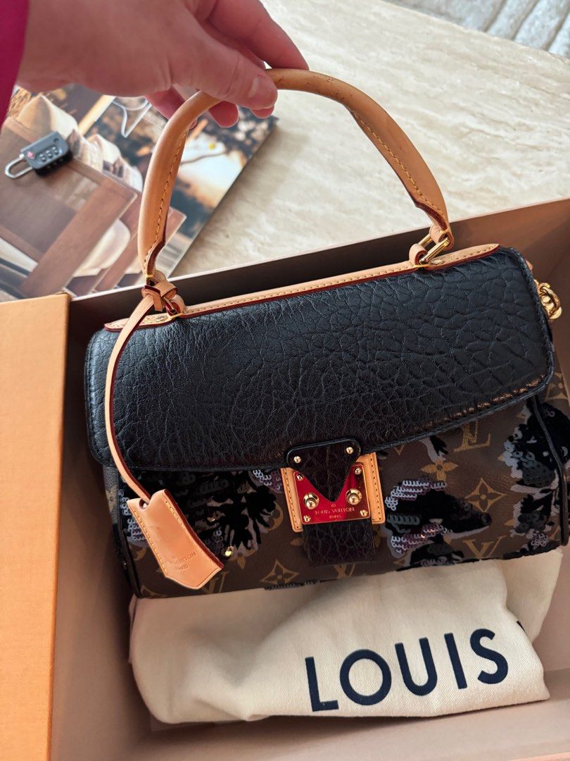 Authentic Louis Vuitton Fleur de jais Carrousel limited edition (Category: Luxury Bags & Wallets) located in Manila. Submitted by houseoflouvre (Listing ID 1365847426, Image 1). Description: Authentic Louis Vuitton limited edition Fleur de jais Carrousel Slightly used Comes complete with box, Dustbag, keys and lock, clochette.. .