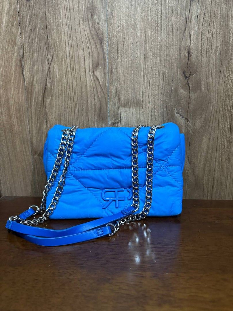 Blue mini shoulder bag [Parfois] original (Category: Shoulder Bags) located in Makati City. Submitted by dontforgetmenot (Listing ID 1365932483, Image 2). Description: 💙 preloved mini kili bag 💙 puffy bag which is super cute 💙 minor stains as shown but not noticable 💙 pm for more details.
