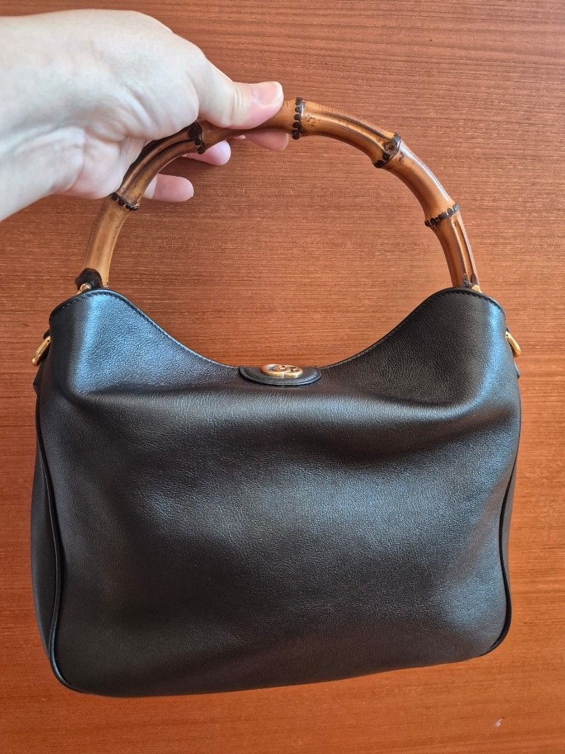 Gucci Diana Bamboo Bag Small (Category: Bags & Wallets) located in Singapore. Submitted by lin_sg (Listing ID 1365915063, Image 2). Description: Condition is as good as new! Comes with 2 straps, one black and one grey Dustbag included Approx 28cm (L) x 20cm (H) x 7cm (W) Price is fixed.