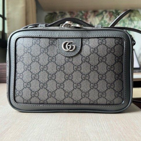 GUCCI OPHIDIA SMALL SHOULDER BAG (Category: Bags & Wallets) located in Singapore. Submitted by hollidexter (Listing ID 1365951313, Image 1). Description: GUCCI OPHIDIA SMALL SHOULDER BAG IN GREY AND BLACK GG SUPREME CANVAS As good as new. Used less than 5 times. Discontinued as far as I know. Original price of $2,380 bought March 2023. No defects at all. Comes with Gucci paper bag, box, cloth bag, receipts and all papers..