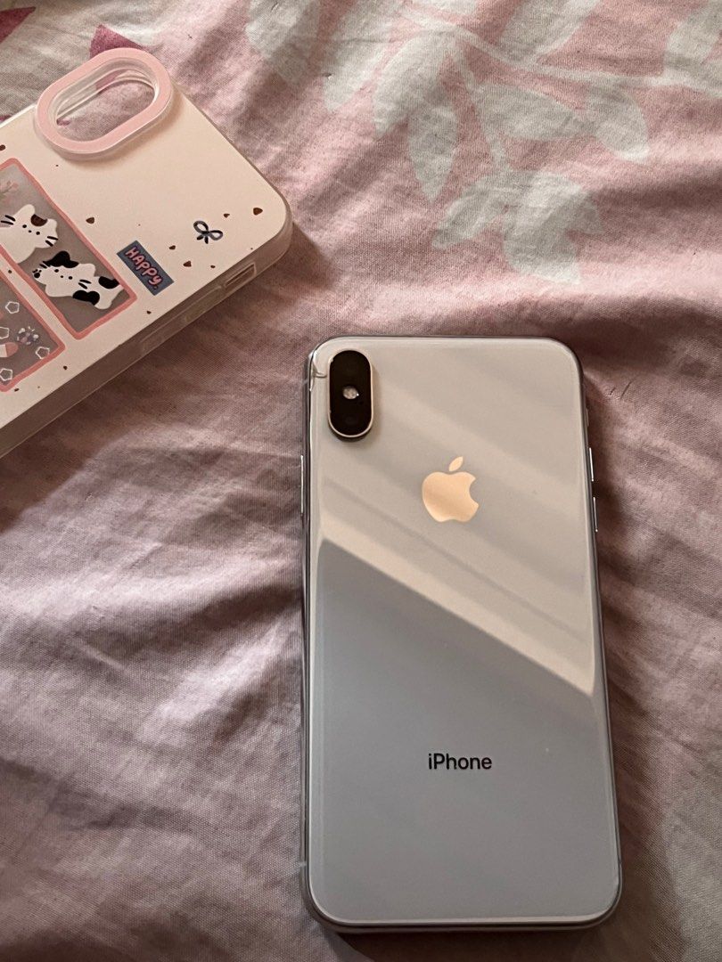 iPhone X 256gb (Category: iPhone X Series) located in Tuguegarao City. Submitted by yichuyaa07 (Listing ID 1365905656, Image 2). Description: iPhone x 256gb Silver bought as preloved Face ID working No true tone Clear camera Issues: - crack near the camera (but it doesn’t affect photos) rfs: - already upgraded & i need funds for an iPad Inclusion: - 2m connector from baseus (well-used) - 2 cases - Privacy tempered glass .
