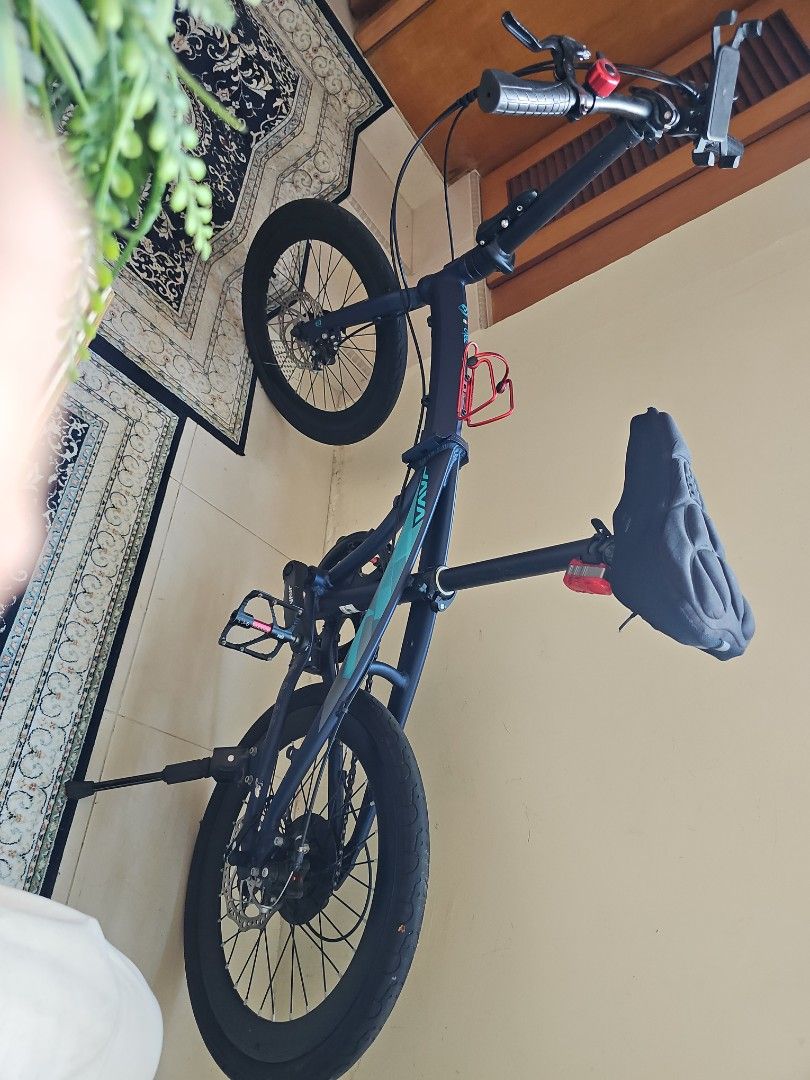 Java Folding Bike (Category: Bicycles) located in Singapore. Submitted by hajipda1 (Listing ID 1365847929, Image 1). Description: Selling a lightly used Java folding bike. It's in good condition and has been well-maintained. It comes with a phone holder, a water bottle holder, and a comfortable saddle. The bike is easy to fold and store, making it perfect for commuting or taking on trips. It's a great option for anyone looking for a convenient an