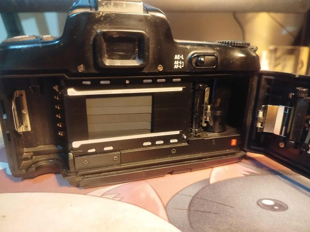 Nikon F-601 Film Camera (Category: Cameras) located in Las Pinas. Submitted by rogelio_sama (Listing ID 1365999874, Image 3). Description: For Sale: Nikon F-601 35mm Film Camera ✅ Fully functional autofocus and exposure settings ✅ Smooth film advance and rewind mechanism ✅ Built-in flash and hot shoe for external flash options ⚡Cosmetic wear on the body — does not affect performance ✅ Film door latch Repaired — Will include spare 3D printed latch