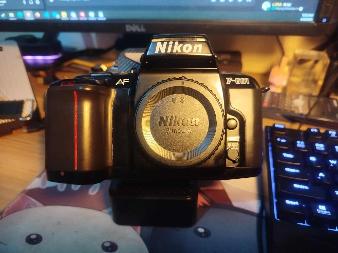 Nikon F-601 Film Camera (Category: Cameras) located in Las Pinas. Submitted by rogelio_sama (Listing ID 1365999874, Image 1). Description: For Sale: Nikon F-601 35mm Film Camera ✅ Fully functional autofocus and exposure settings ✅ Smooth film advance and rewind mechanism ✅ Built-in flash and hot shoe for external flash options ⚡Cosmetic wear on the body — does not affect performance ✅ Film door latch Repaired — Will include spare 3D printed latch