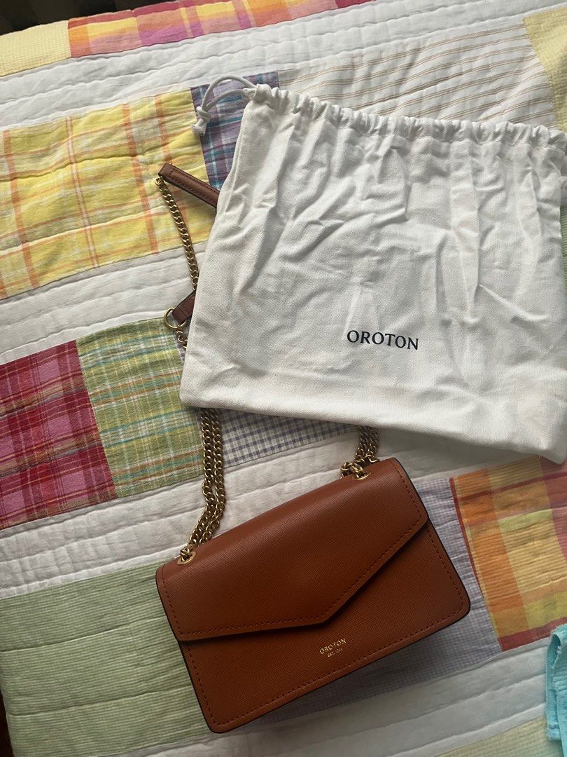 Oroton 2 Way Brown Saffiano Leather Bag (Category: Cross-body Bags) located in Paranaque City. Submitted by _lexus (Listing ID 1365836815, Image 2). Description: Original Oroton Brown Saffiano Leather Mini Bag From Australia, bought directly from store Can be worn 2 ways; as a shoulder or cross body bag Great condition, used only 5x No scratches, still in great shape With minor scratches on magnet clasp closure but you cant see this cause its alw