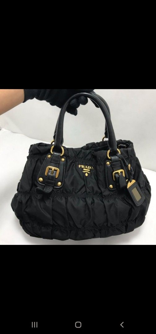 Prada Tessuto Gaufre Nylon Tote Bag in Black GHW (Category: Bags & Wallets) located in Singapore. Submitted by iicegal (Listing ID 1365851118, Image 1). Description: ❤️100% guaranteed authentic ❤️bought new and lightly used ❤️ only owner, non smoking, no pets environment ❤️ cleaned in Apr 25, proof of receipt available. not used since then..