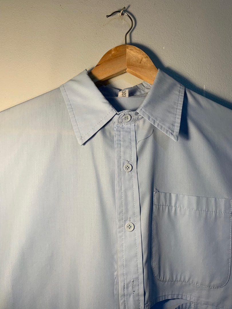 random unique light blue polo long sleeve unisex (Category: Tshirts & Polo Shirts ) located in Manila. Submitted by rienkay (Listing ID 1365946520, Image 2). Description: random brand light blue polo long sleeve L 29-30 in W 23 in stylish half cut on the front side of polo (see pic 3)... can be worn alternatively using bottom half buttons (see last pic) used 1-2 times, very good quality, great color, can play around with the style ! dm for more i