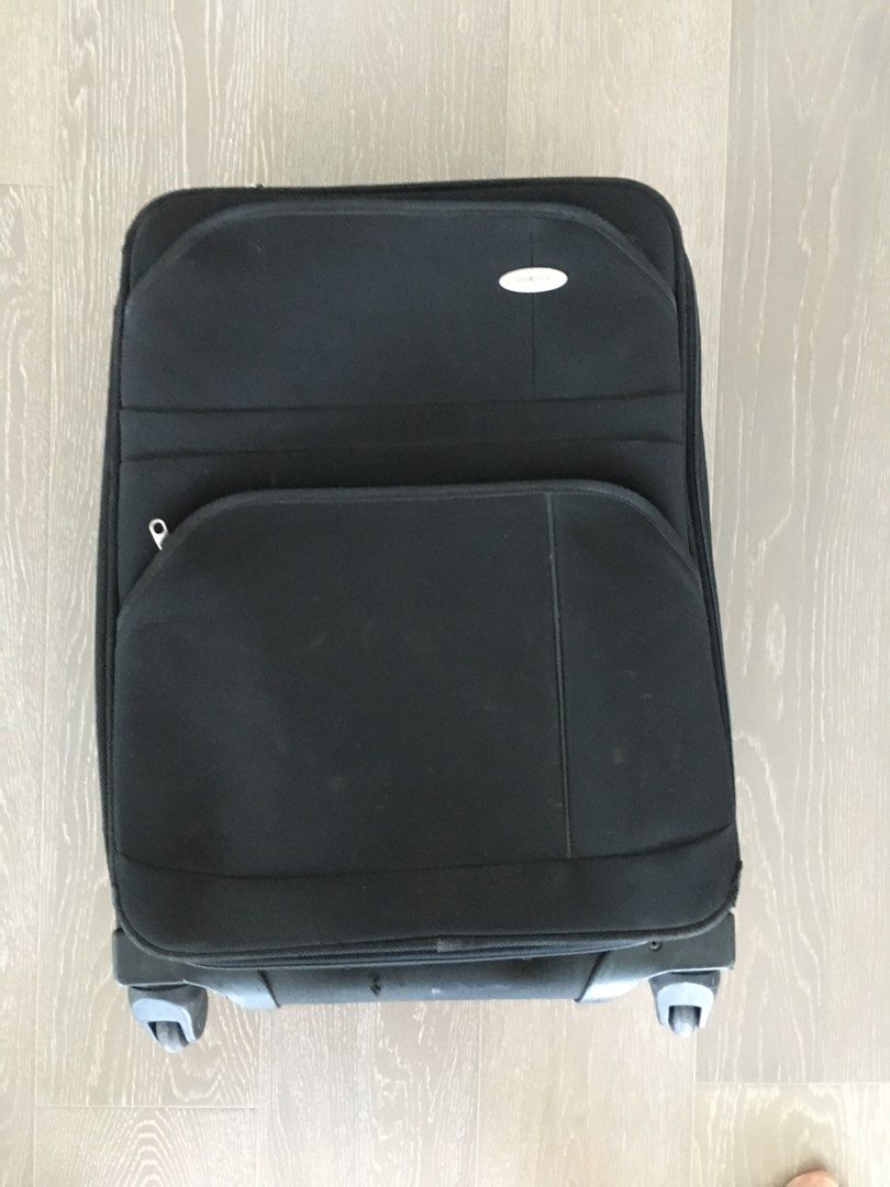 Samsonite carry-on luggage (Category: Luggage) located in Makati City. Submitted by savedeal (Listing ID 1365829363, Image 2). Description: Well-used Samsonite cabin luggage. Inner large compartment and zippered inner top. Exterior features two zippered front pockets. Softcase, 4 wheel 360 swivel and expandable. Some minor scratches and sticker residue that can be removed easily. Exterior corners showing wear. See photos.