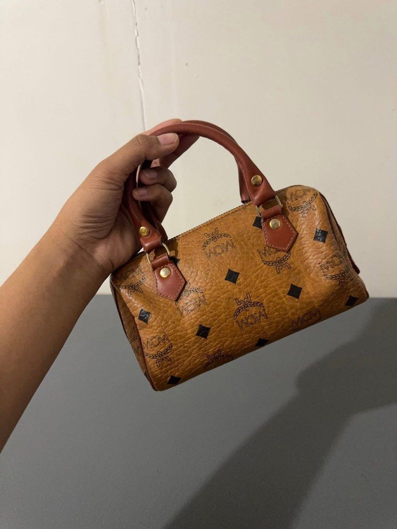 Authentic McM Nano Bag (Category: Luxury Bags & Wallets) located in Quezon City. Submitted by jhaediah (Listing ID 1366068457, Image 2). Description: preloved and good condition Nano m CM Cute! Bili nalang kayo ng strap .